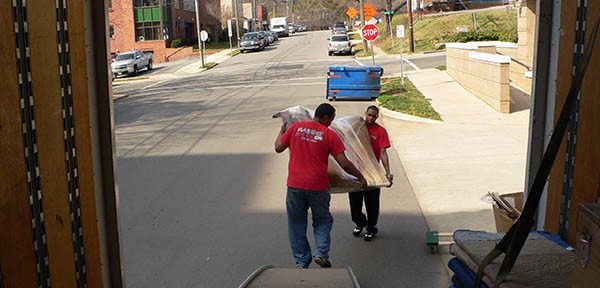 Two Marrin's Moving employees loading a moving truck in North Carolina