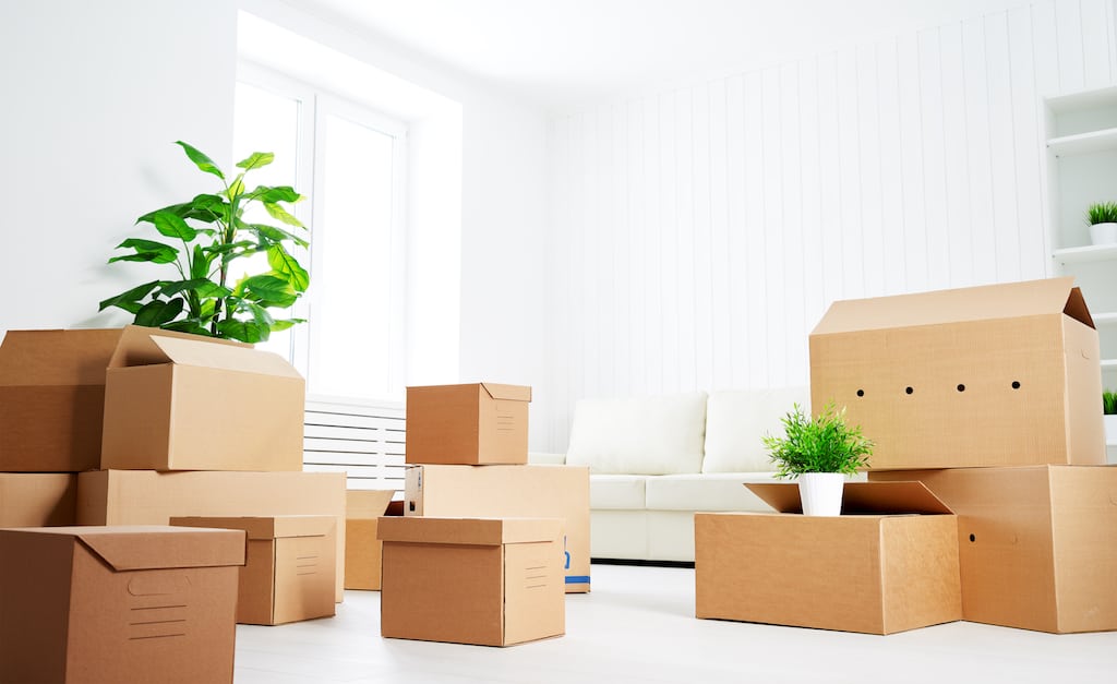 A room full of cardboard boxes waiting to be unpacked